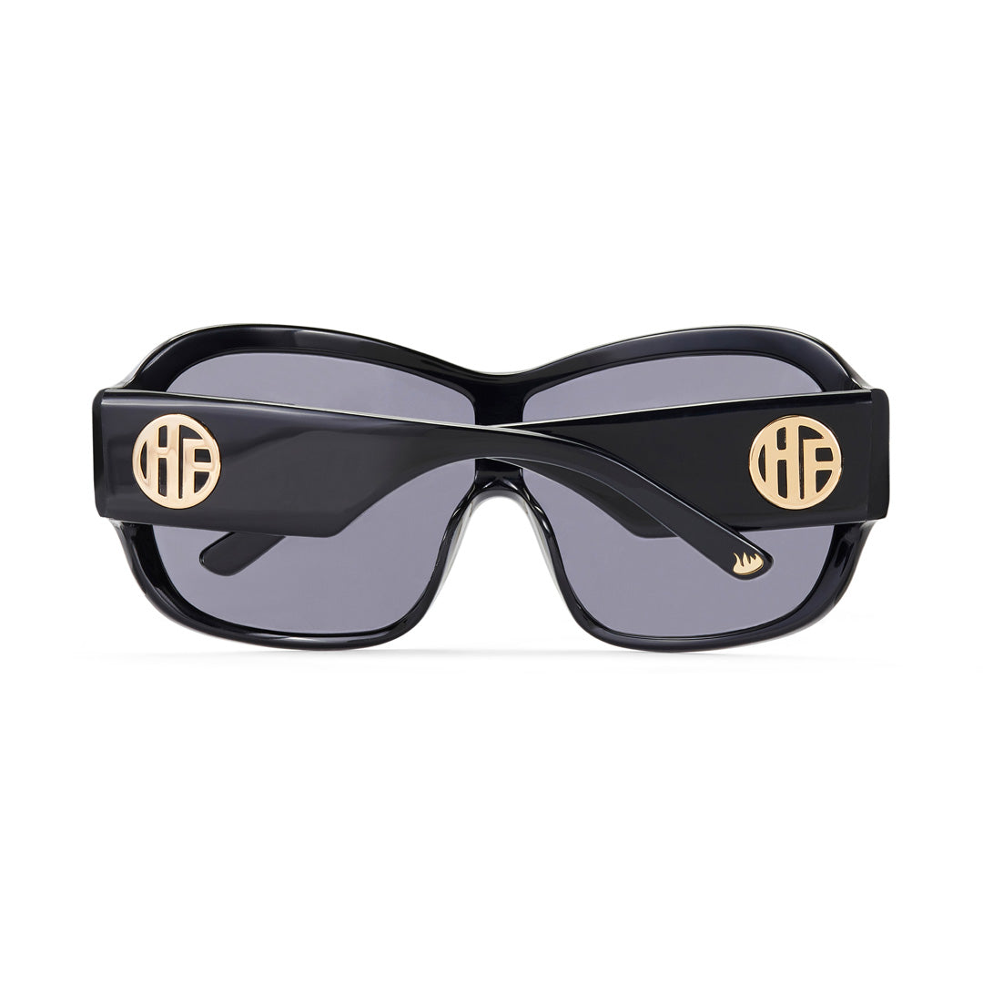 the back of the Gloss Black Hot Futures wraparound Sunglasses with both arms folded showing the gold HF logo