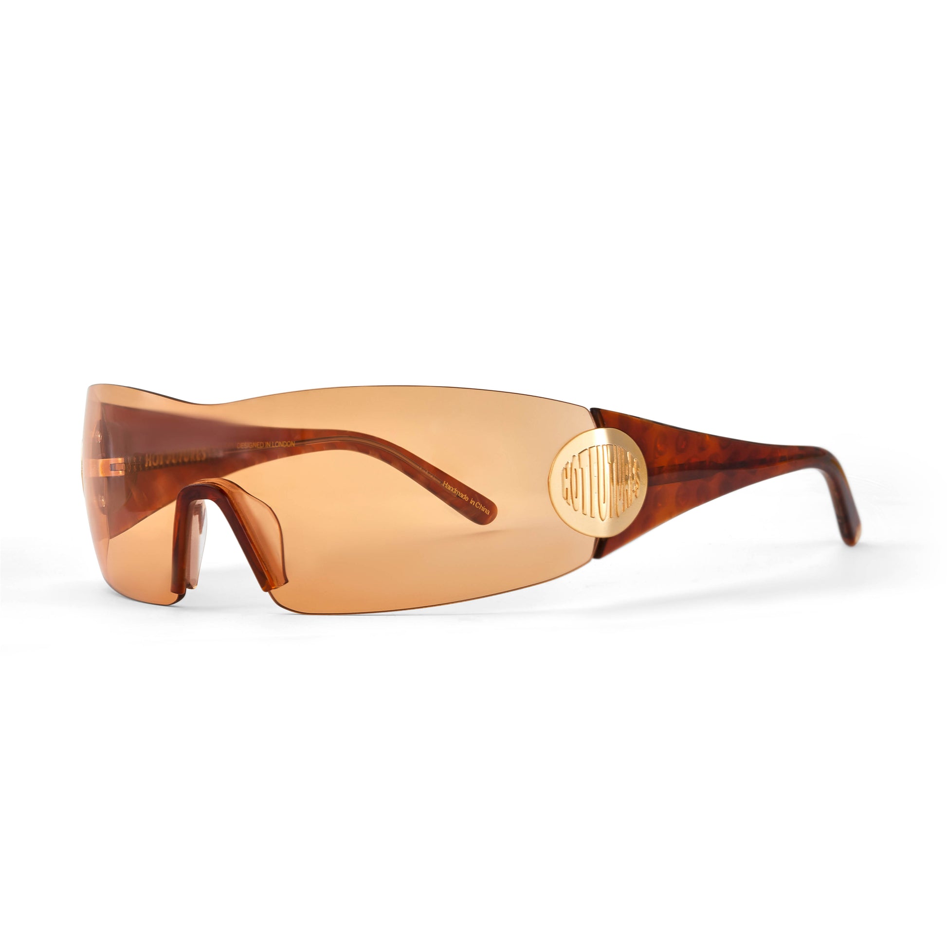 Club Kid y2k style wrapround sunglasses in amber/gold/brown against a white background.