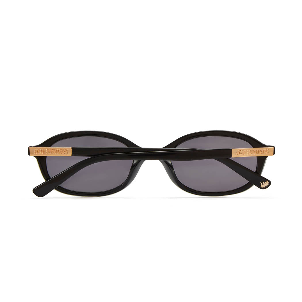 back shot of cupid sunglasses in gloss black folded.