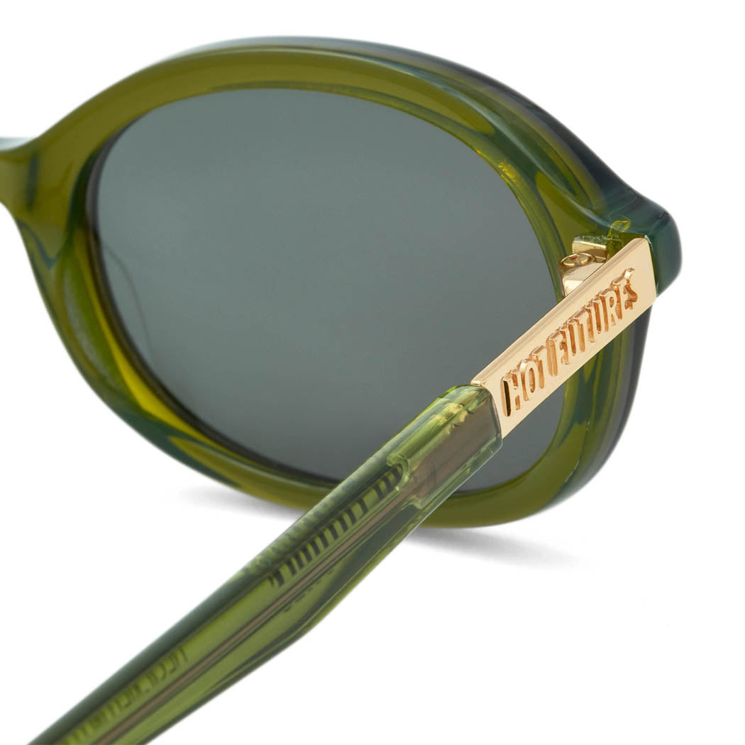 close up shot of the Cupid Sunglasses in dark green, with the Hot Futures Gold text branding