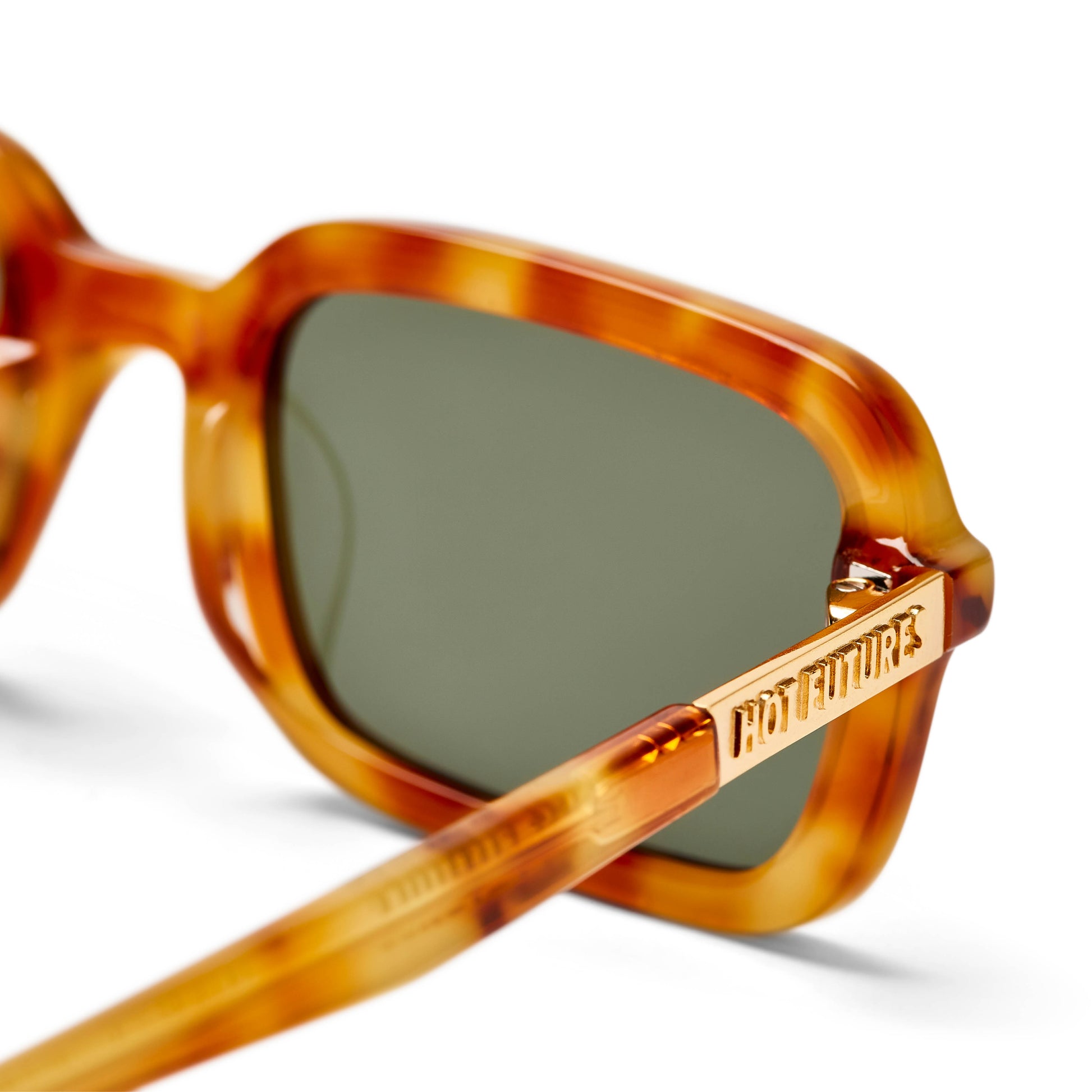 close up shot of Dazed tortoiseshell caramel dark green frame sunglasses