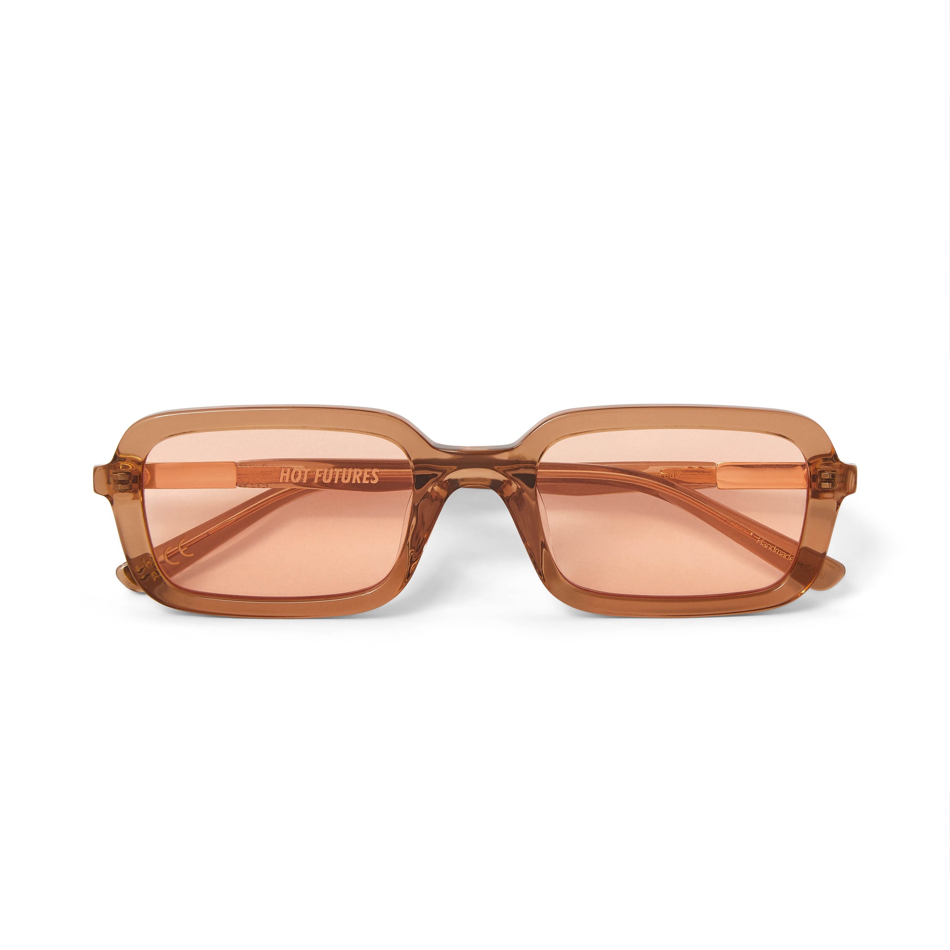 A pair of beige rectangular sunglasses with amber tinted lenses.