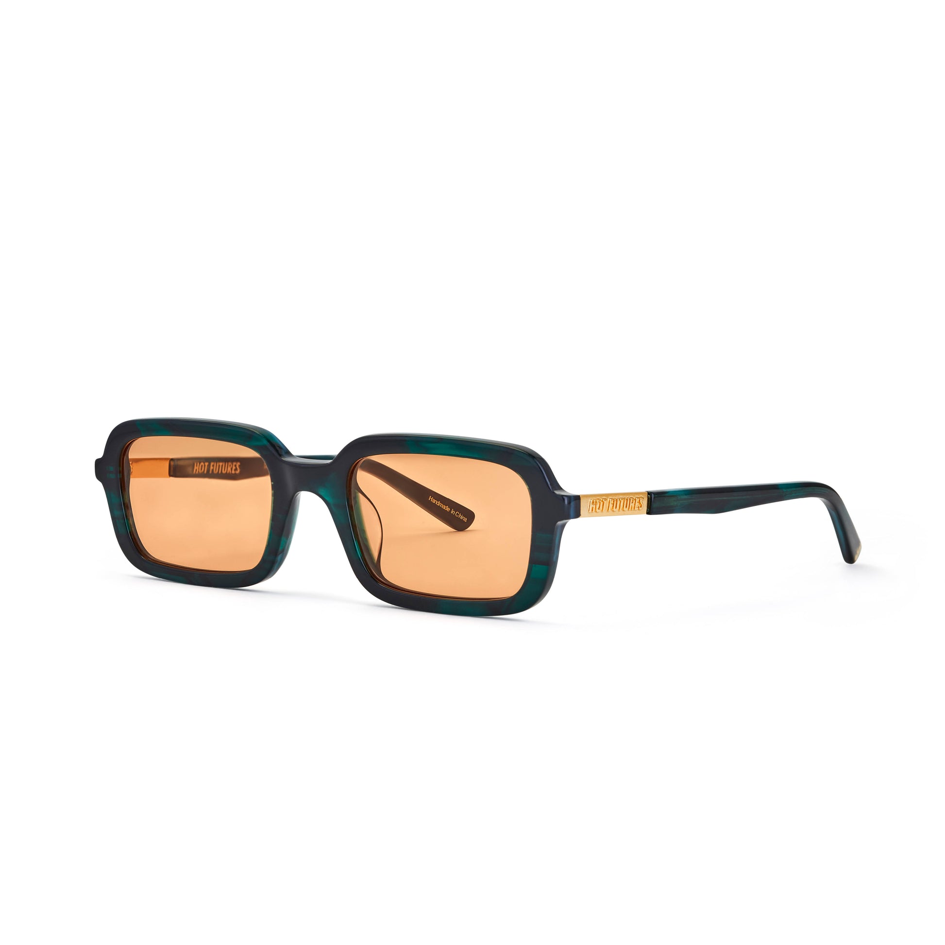 A pair of sunglasses with green crystal frame and orange tinted lenses, with a Y2K inspired soft slim rectangle frame.