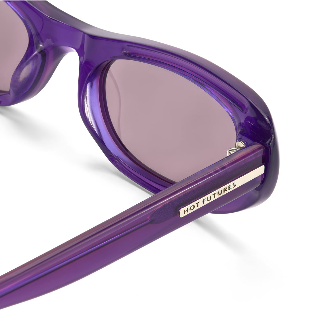 Close-up of purple sunglasses with 'Hot Futures' branding on a white background