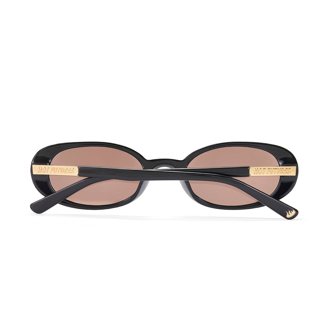 Black oval sunglasses with gold accents on a white background