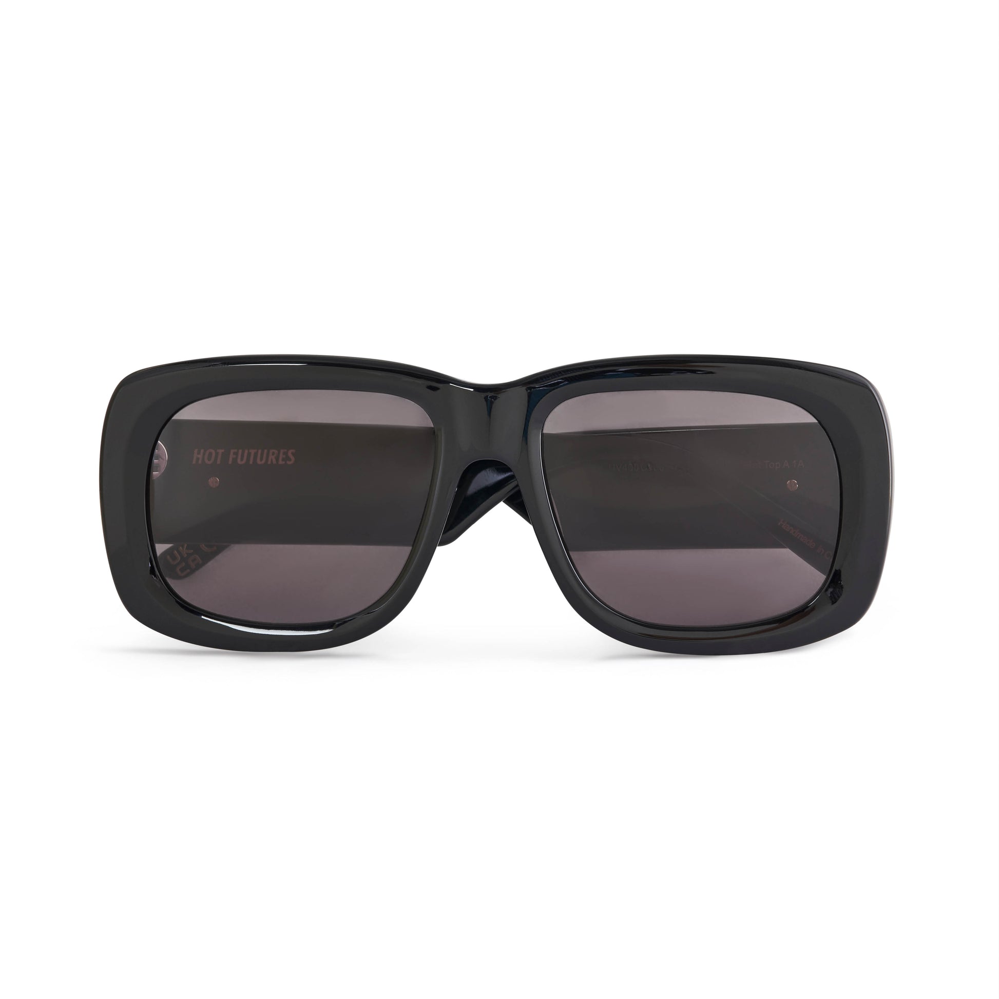 A pair of glossy black acetate flat top large sunglasses with dark smoky tinted lenses