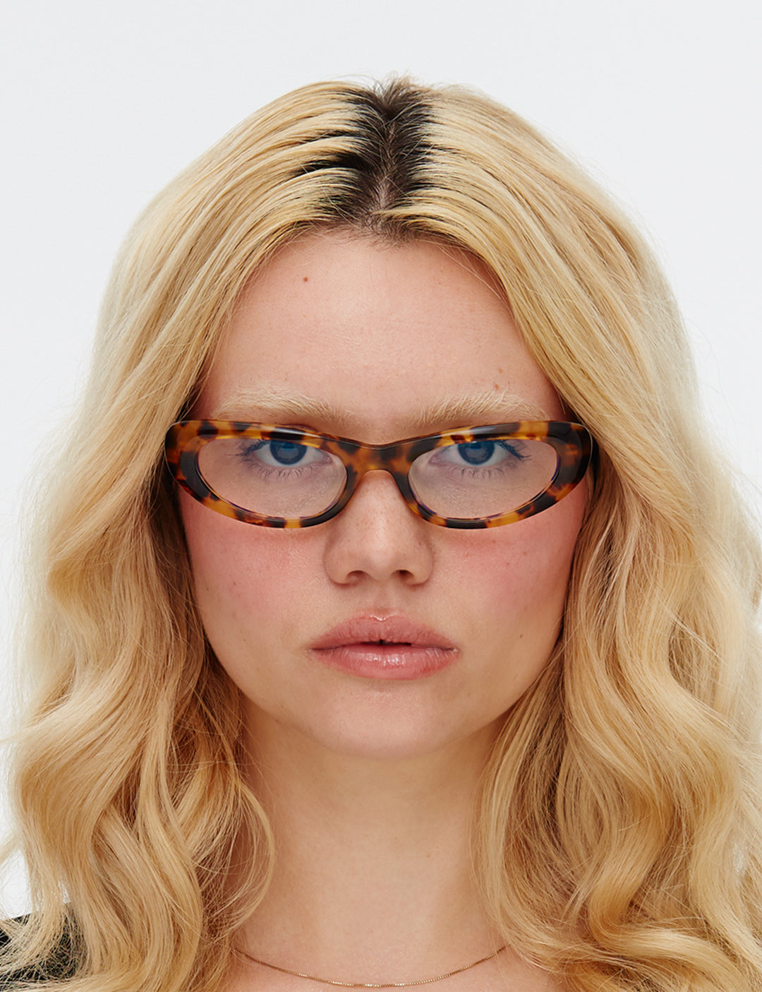Tortoiseshell cat-eye glasses on a white background