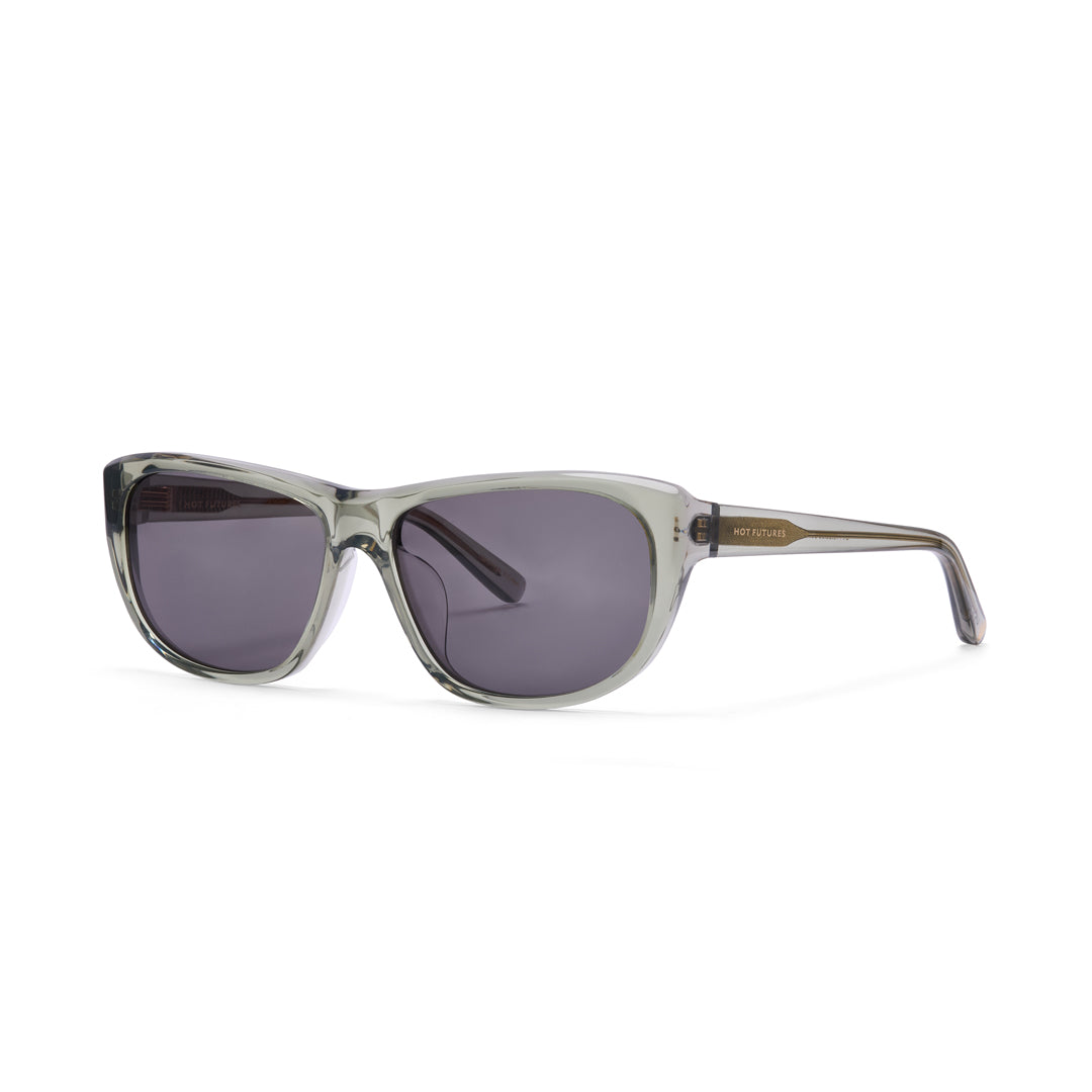 Sunglasses with a clear moss green frame and dark lenses on a white background