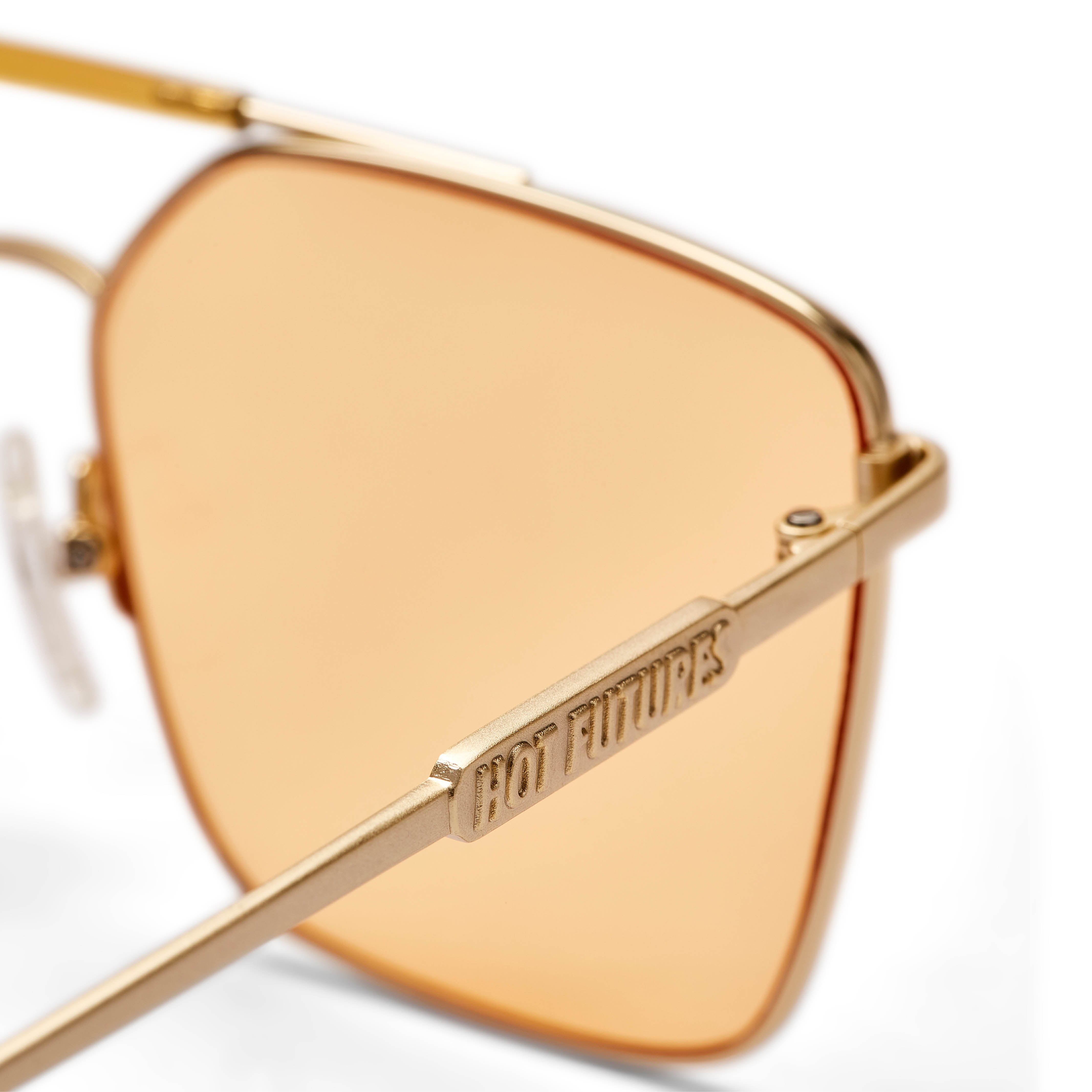 Gold lens aviator retailer sunglasses