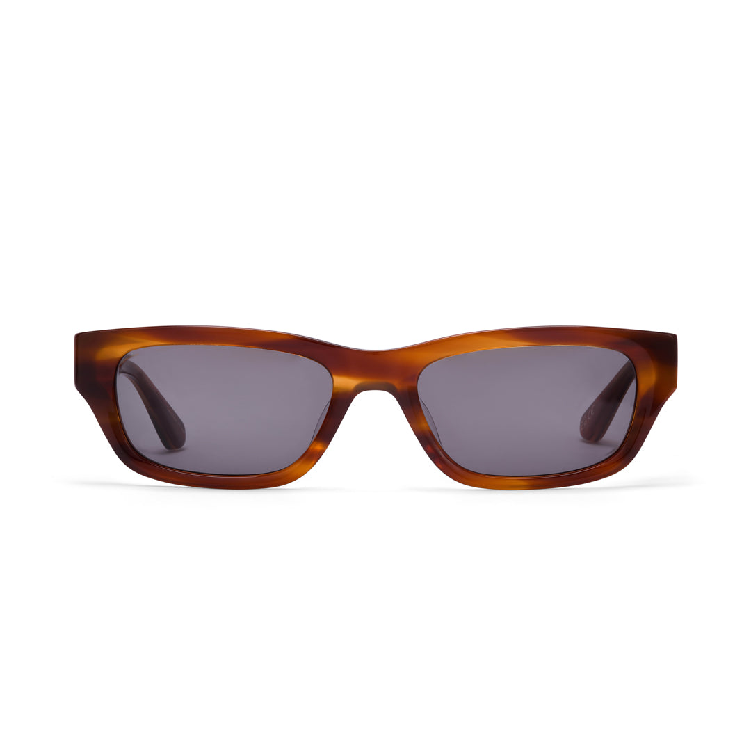 Dove sunglasses in caramel with dark green lenses by Hot Futures against a white backdrop