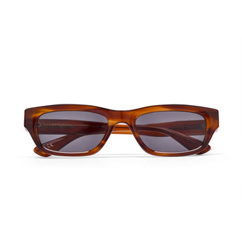 Brown sunglasses with a tortoiseshell frame on a white background