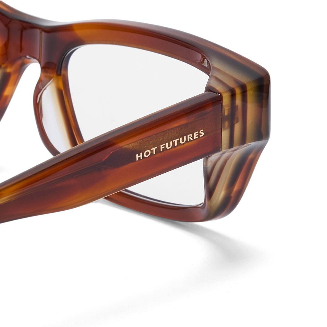 Brown sunglasses with 'HOT FUTURES' branding on a white background