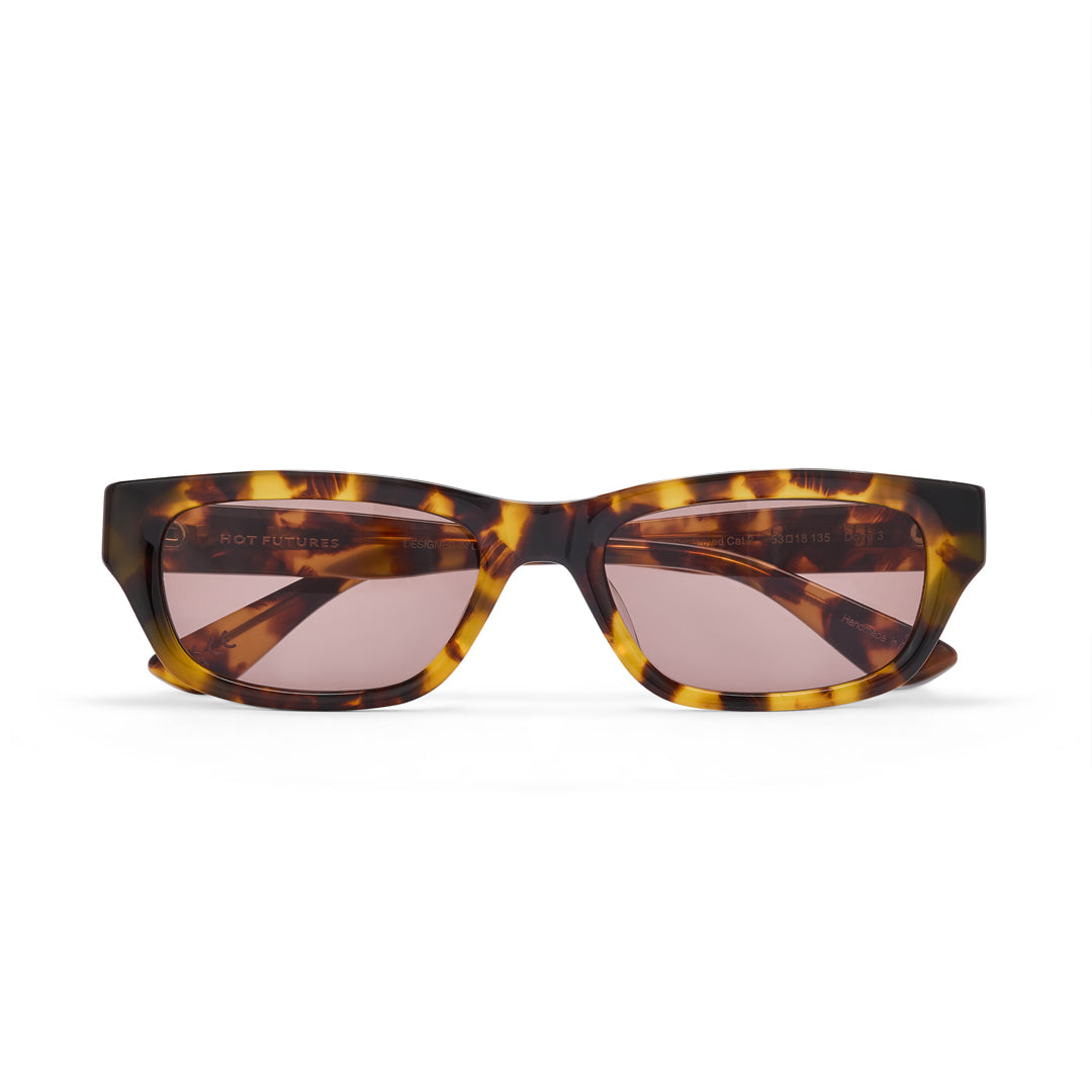 Tortoiseshell sunglasses with pink lenses on a white background