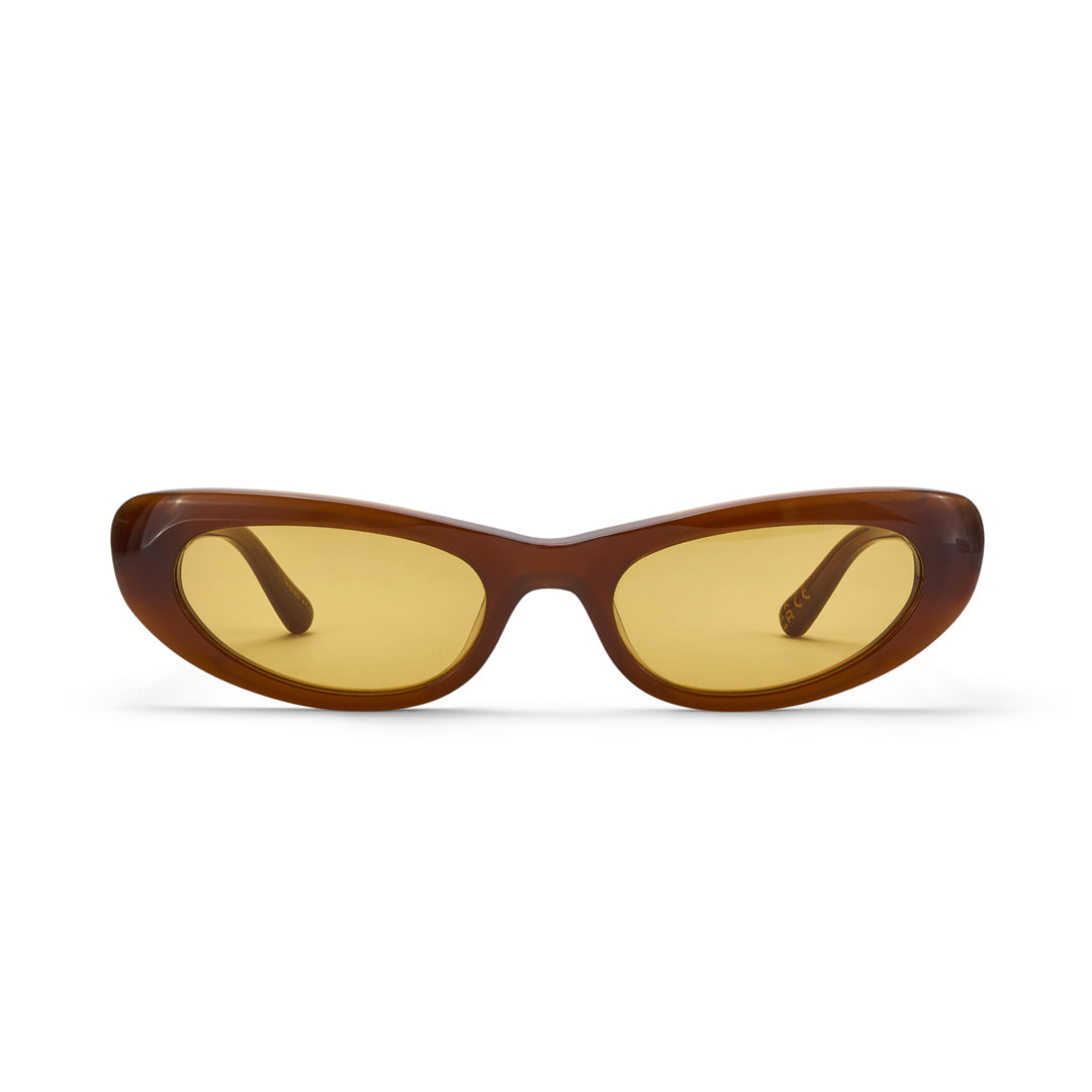 Sunglasses with brown frame and yellow lenses on a white background