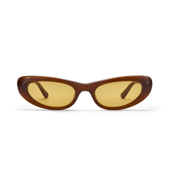 Sunglasses with brown frame and yellow lenses on a white background
