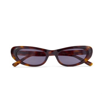 Sunglasses with tortoiseshell frame and dark lenses on a white background