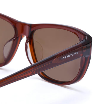 Brown sunglasses with 'HOT FUTURES' branding on a white background