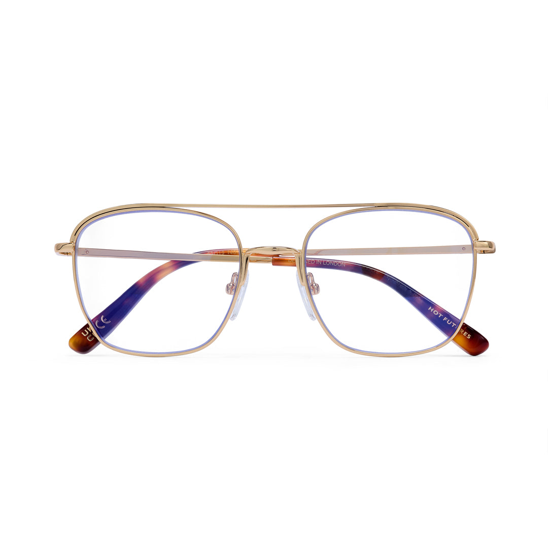 Gold-framed eyeglasses with multicolored lenses on a white background