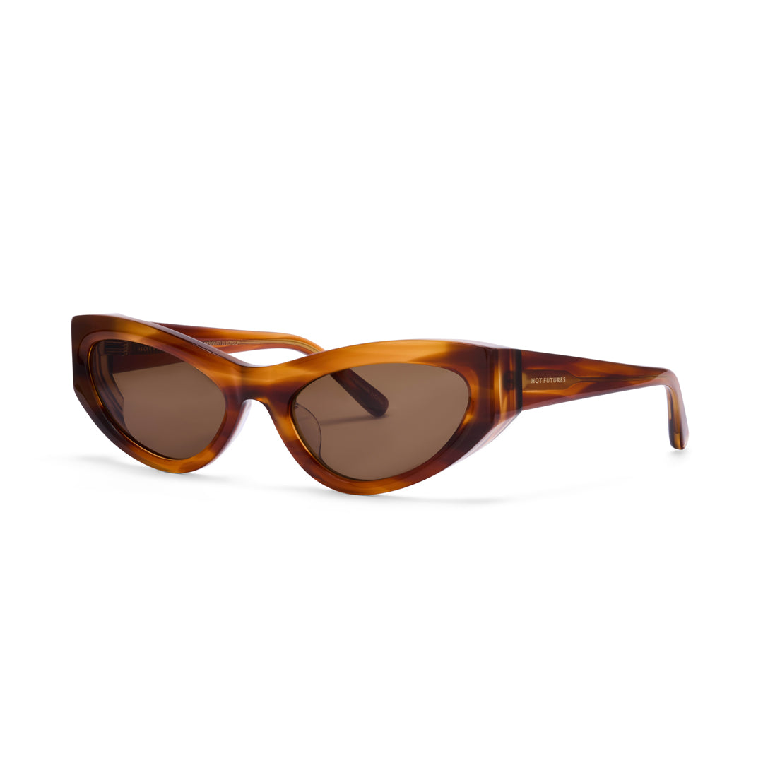 Hot Futures Storm cat eye shaped caramel brown sunglasses with brown lenses on a white backdrop